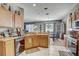 Kitchen with an island and plenty of cabinet space at 15521 Long Cypress Dr, Ruskin, FL 33573