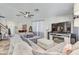 Living room with sectional sofa and large TV at 15521 Long Cypress Dr, Ruskin, FL 33573