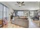 Open concept living area with sectional sofa and dining area at 15521 Long Cypress Dr, Ruskin, FL 33573