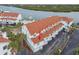 Aerial view of condo complex near waterway, highlighting subject property at 19201 Vista Ln # C8, Indian Shores, FL 33785