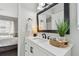 Vanity with modern fixtures and a view of a bedroom at 19201 Vista Ln # C8, Indian Shores, FL 33785