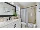 Clean bathroom with a shower/tub combo and white vanity at 19201 Vista Ln # C8, Indian Shores, FL 33785