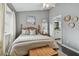 Bright bedroom with a queen-size bed and ensuite bathroom access at 19201 Vista Ln # C8, Indian Shores, FL 33785