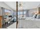 Main bedroom with a workspace, king-size bed, and balcony access at 19201 Vista Ln # C8, Indian Shores, FL 33785