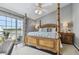 Main bedroom with king-size bed and water views at 19201 Vista Ln # C8, Indian Shores, FL 33785