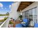 Relaxing deck with blue chair and beautiful water views at 19201 Vista Ln # C8, Indian Shores, FL 33785