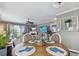 Charming dining area with a wooden table and seating for four at 19201 Vista Ln # C8, Indian Shores, FL 33785