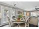 Casual dining area with wood table and four chairs near kitchen at 19201 Vista Ln # C8, Indian Shores, FL 33785