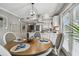 Bright dining area with a wood table and four chairs at 19201 Vista Ln # C8, Indian Shores, FL 33785