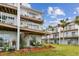 Two-story building with balconies and patio at 19201 Vista Ln # C8, Indian Shores, FL 33785