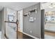 Hallway with hardwood floors, decorative shelving, and access to other rooms at 19201 Vista Ln # C8, Indian Shores, FL 33785