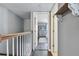 Upper level hallway with hardwood floors and access to bedrooms at 19201 Vista Ln # C8, Indian Shores, FL 33785