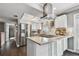 Eat-in kitchen boasting stainless steel appliances and an island at 19201 Vista Ln # C8, Indian Shores, FL 33785