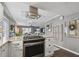 Modern kitchen with stainless steel appliances and an island at 19201 Vista Ln # C8, Indian Shores, FL 33785