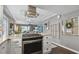 Bright kitchen featuring updated cabinetry and a gas cooktop at 19201 Vista Ln # C8, Indian Shores, FL 33785