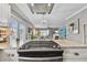 Modern kitchen with stainless steel appliances and a breakfast bar at 19201 Vista Ln # C8, Indian Shores, FL 33785