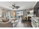 Cozy living room with fireplace, comfortable seating and large TV at 19201 Vista Ln # C8, Indian Shores, FL 33785