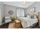 Main bedroom with hardwood floors, and white bedding at 19201 Vista Ln # C8, Indian Shores, FL 33785