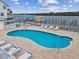 Relaxing kidney-shaped pool with waterfront access at 19201 Vista Ln # C8, Indian Shores, FL 33785