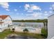 Community pool and relaxing waterfront view at 19201 Vista Ln # C8, Indian Shores, FL 33785