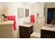 Double vanity bathroom with granite countertops at 2320 Marksmen Ct # 205, Sun City Center, FL 33573