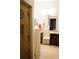 Bathroom with granite vanity, shower, and bead curtain at 2320 Marksmen Ct # 205, Sun City Center, FL 33573
