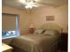 Guest bedroom with queen-size bed and window at 2320 Marksmen Ct # 205, Sun City Center, FL 33573