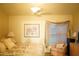 Bright bedroom with king-size bed and window seat at 2320 Marksmen Ct # 205, Sun City Center, FL 33573