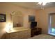 Bedroom with dresser, TV, and window seat at 2320 Marksmen Ct # 205, Sun City Center, FL 33573