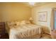 Spacious Primary bedroom with king-size bed and sitting area at 2320 Marksmen Ct # 205, Sun City Center, FL 33573