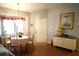 Bright dining area with a table, chairs, and hardwood floors at 2320 Marksmen Ct # 205, Sun City Center, FL 33573