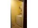 Functional laundry room with washer, dryer, and shelving at 2320 Marksmen Ct # 205, Sun City Center, FL 33573
