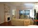 Living Room with hardwood floors, couches, and a view of a bedroom and screened porch at 2320 Marksmen Ct # 205, Sun City Center, FL 33573