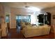 Living room with light teal couches and access to a screened porch at 2320 Marksmen Ct # 205, Sun City Center, FL 33573