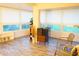 Bright sunroom with wood-look flooring and ample natural light at 2320 Marksmen Ct # 205, Sun City Center, FL 33573