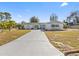 Ranch style home with a long driveway at 240 Timberlane Dr, Palm Harbor, FL 34683