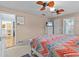 Bright bedroom with ceiling fan and en-suite bathroom access at 240 Timberlane Dr, Palm Harbor, FL 34683