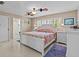 Spacious main bedroom with ceiling fan and en-suite bathroom at 240 Timberlane Dr, Palm Harbor, FL 34683