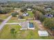 Aerial view of a single-Gathering home with a pool and large yard at 25555 Oaks Blvd, Land O Lakes, FL 34639