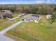 Aerial view of a single-Gathering home with a pool and large yard at 25555 Oaks Blvd, Land O Lakes, FL 34639