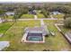 Aerial view showing a house, pool, and expansive backyard at 25555 Oaks Blvd, Land O Lakes, FL 34639