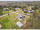 Aerial view of a single-Gathering home with a pool and large yard at 25555 Oaks Blvd, Land O Lakes, FL 34639