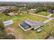 Aerial view of a house with a pool and a large yard at 25555 Oaks Blvd, Land O Lakes, FL 34639