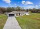 Aerial view of a single-Gathering home with a large yard at 25555 Oaks Blvd, Land O Lakes, FL 34639