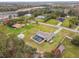 Aerial view of a house with a pool and large backyard at 25555 Oaks Blvd, Land O Lakes, FL 34639