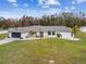 Aerial view of a single-Gathering home with a large yard at 25555 Oaks Blvd, Land O Lakes, FL 34639