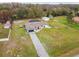 Aerial view of a single-Gathering home with a pool and large yard at 25555 Oaks Blvd, Land O Lakes, FL 34639