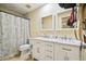Bathroom with double vanity and large mirror at 25555 Oaks Blvd, Land O Lakes, FL 34639
