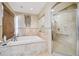 Bathroom with soaking tub and walk-in shower at 25555 Oaks Blvd, Land O Lakes, FL 34639