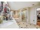 Bathroom with soaking tub and walk-in shower at 25555 Oaks Blvd, Land O Lakes, FL 34639